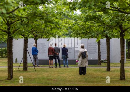 03 May 2018, Germany, Eschede: Visitors commemorating the victims of the train accident in Eschede for the 20th anniversary of the accident. The ICE 'Wilhelm Conrad Roentgen' derailed on the 3 June 1998 at tempo 200 and drove into a highway bridge. 101 people died. Photo: Philipp von Ditfurth/dpa Stock Photo