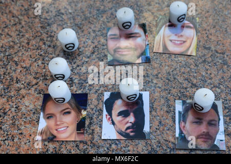 London Bridge, Southwark, London, 3rd June 2018. A small candle memorial with photos of some of the victims has been placed underneath London Bridge.Following a service at Southwark Cathedral commemorating the first anniversary of the London Bridge terror attack, those who died or were harmed in the attack are remembered by a procession. Credit: Imageplotter News and Sports/Alamy Live News Stock Photo