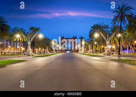 Bacelona Arc de Triomf at night in the city of Barcelona in Catalonia, Spain. The arch is built in reddish brickwork in the Neo-Mudejar style Stock Photo