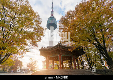 Seoul Tower with yellow and red autumn maple leaves at Namsan mountain in South Korea. Stock Photo