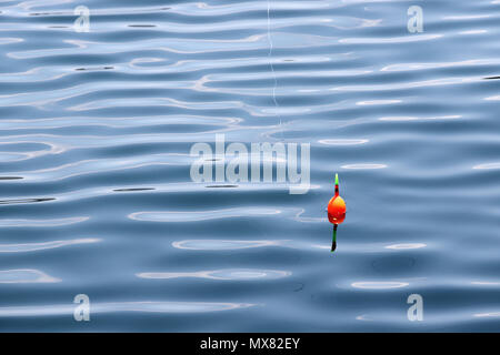 fishing float on the water, Bobber Stock Photo - Alamy
