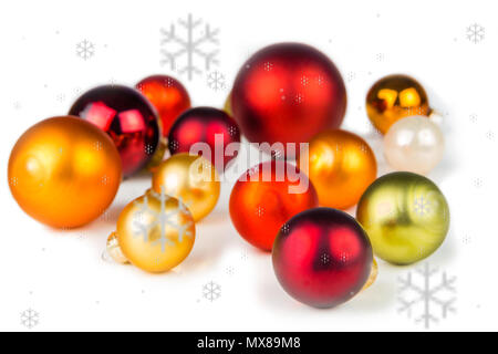 multicolored christmas balls on white background with snowflakes everywhere Stock Photo
