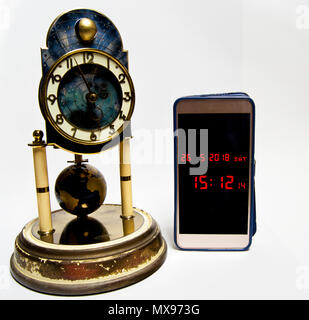 evolution of time measurement from historical clock to modern smartphone. Stock Photo