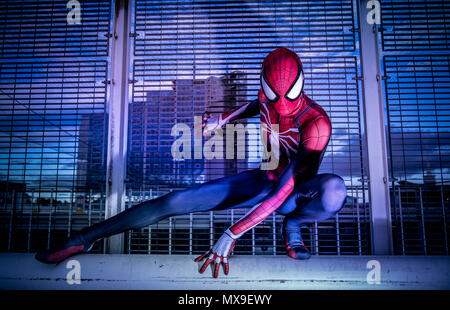 ultra-sharp full body photography of a female marvel spiderman sitting in  an high fashion pose