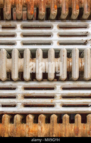 Stacked discarded cast-iron radiators Stock Photo