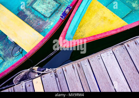 The colorful recreational boats and wooden pier from top view angle Stock Photo