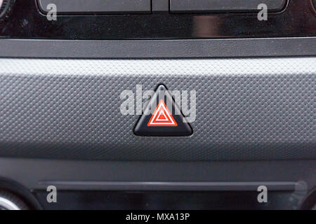 Emergency button on the car panel. Alarm button in the car Stock Photo