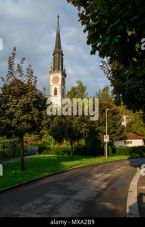 Beautiful Saint Sankt St. Jacob Jakob church kirche bell-tower from Seestrasse street, Cham (ZG), Switzerland on a sunny summer morning Stock Photo