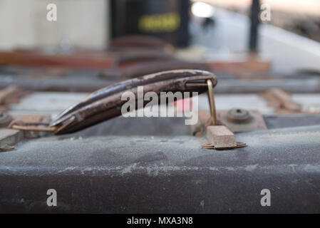 Retro suitcases stacked side-by-side at a train railway station. Travel concept Stock Photo