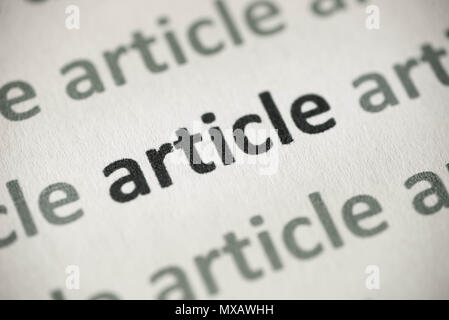 word article printed on white paper macro Stock Photo