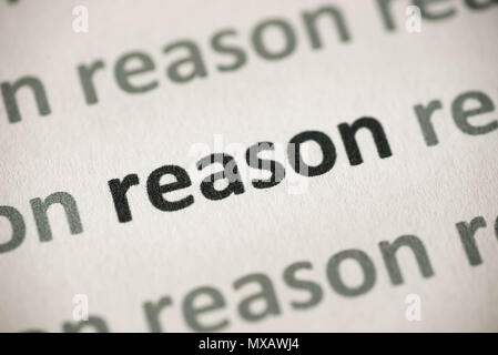 word reason printed on white paper macro Stock Photo