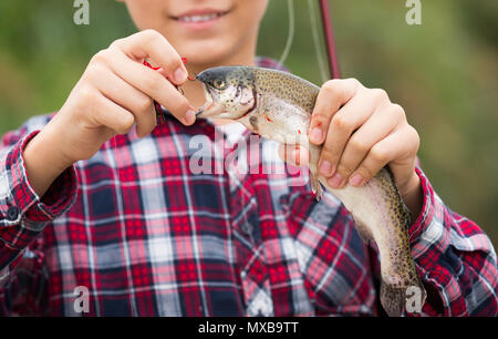 Kid holding fishing pole hi-res stock photography and images