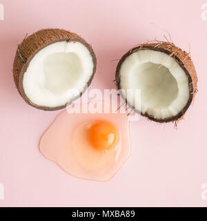 Coconut in form of broken egg minimal abstract creative concept. Stock Photo
