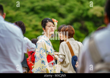 KYOTO, JAPAN- JUNE 8, 2015: Unidentified Japanese woman in traditional dress in Kyoto, Japan Stock Photo