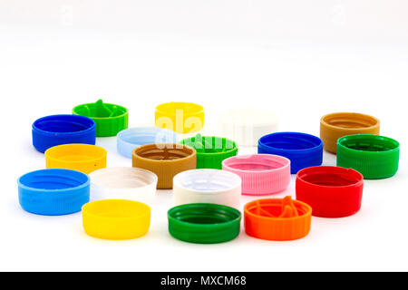 Colorful plastic bottle caps. Studio shot. Plastic waste. Isolated on a white background. Stock Photo