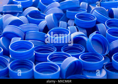 Blue plastic bottle caps. Studio shot. Plastic waste. Stock Photo