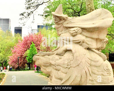 Mother Goose Statue in Central Park with Spring Blossoms, NYC, USA Stock Photo