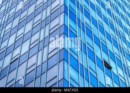 symmetrical image of glassy modern building, with one window open on northern side of the skyscraper