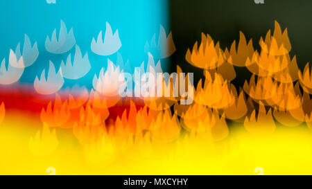 beautiful bokeh made of blurred lights in the form of flames on multicolored background, illusion of  fire Stock Photo