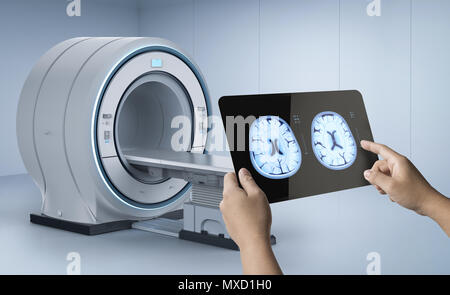 Hand holding 3d rendering tablet display x-ray brain with mri scan machine Stock Photo