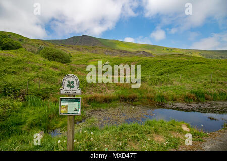 Mam Tor, a hill in the English Peak District with its National Trust sign in the foreground. The name of this peak means 'Mother Hill' Stock Photo