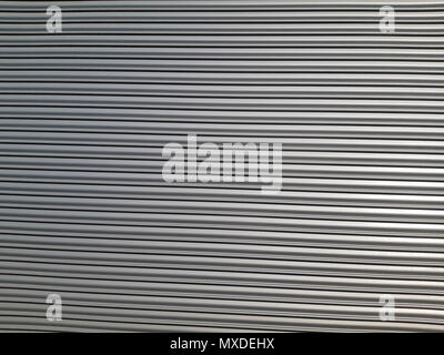 Old metal blinds painted with thick layer of light paint as background Aluminum blinds background. Stock Photo