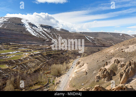 View of mountain landscapes and road to rock village Kandovan in spring. East Azerbaijan province. Iran Stock Photo