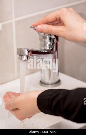 Woman washing her hands at home with antibacterial soap Stock Photo - Alamy