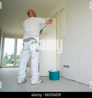 Craftsman renovating an apartment Stock Photo