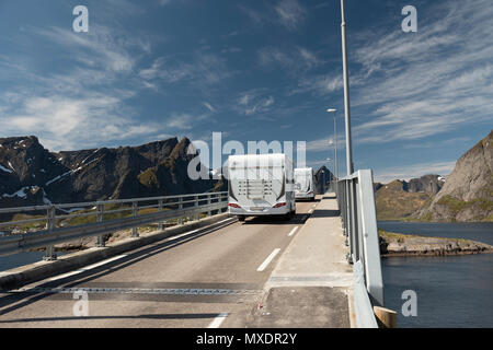 Camper vans driving over a bridge at Hamnoy, Lofoten Islands, Norway. Stock Photo