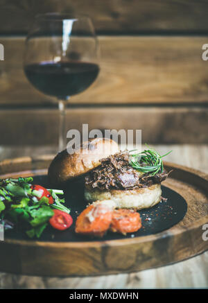 homemade pulled pork burger with coleslaw and bbq sauce Stock Photo