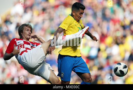 Croatia's Tin Jedvaj (left) and Brazil's Roberto Firmino battle for the ball during the International Friendly match at Anfield, Liverpool. Stock Photo