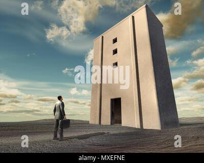 Businessman in front of a large building in a wasteland Stock Photo