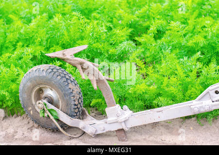 A manual plow on an electric winch. Cultivator. Agricultural tools, farming. Agriculture. Plowing the ground before planting, cultivating plants, harv Stock Photo