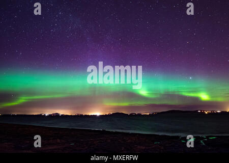 Northern lights aurora seaside color in norway Stock Photo