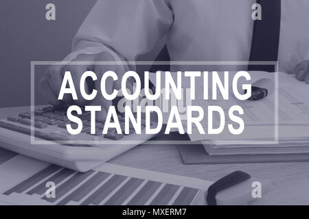 Accounting standards concept. Man working with report. Stock Photo