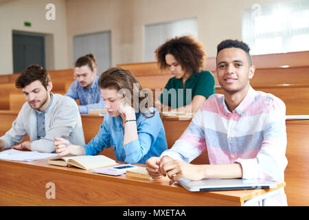 Students at desk Stock Photo