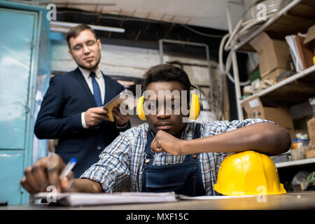 Lathe Operator Wrapped up in Work Stock Photo