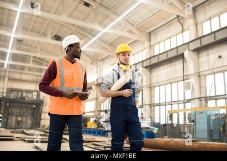 Technicians Discussing Joint Work Stock Photo