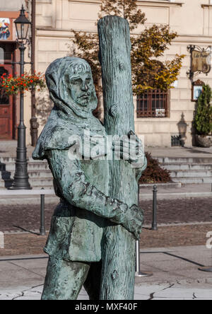 WIELICZKA, POLAND - OCTOBER 26, 2015: Detail of sculpture in the central square of Wieliczka - one of the miners emerging from an underground salt min Stock Photo