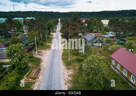 Russian urban-type settlement with wooden houses in green forests of Leningrad region, Russia. Stock Photo