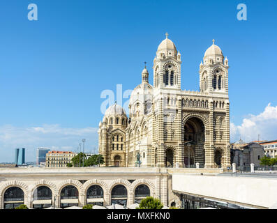 The Sainte-Marie-Majeure cathedral, also known as La Major, with the arches of the shopping center beneath and the towers of the Arenc district in the Stock Photo