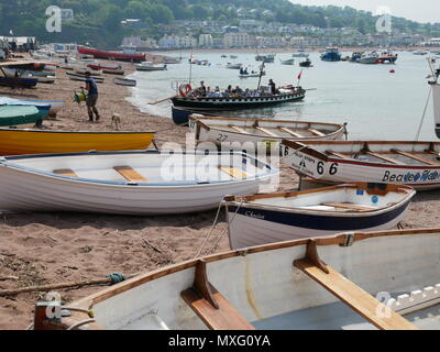 Boats on the beach and the ferry to Shaldon at Teignmouth, Devon, England. Stock Photo