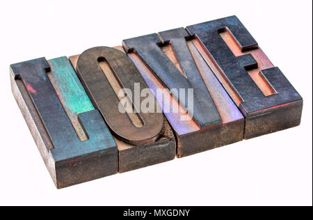love  - isolated word abstract in vintage wooden letterpress type blocks, stained by color ink Stock Photo