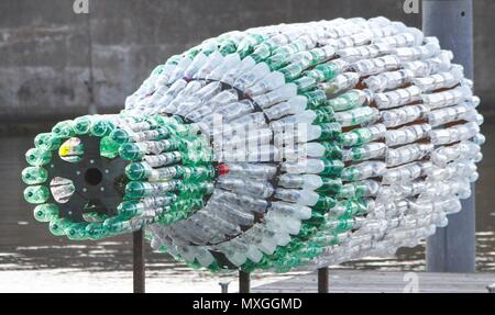 New Brighton, Merseyside. 3rd Jun, 2018. A GIANT sculpture addressing the issue of plastic pollution has been unveiled in New Brighton,Merseydide Artist Lulu Quinn's 'Message in a Bottle' is a 26ft (8m) bottle made entirely from recycled plastic, which at night becomes a beacon, illuminated from within.credit Ian Fairbrother/Alamy Live news Stock Photo