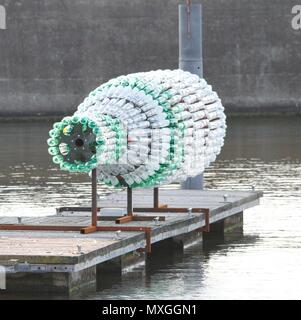 New Brighton, Merseyside. 3rd Jun, 2018. A GIANT sculpture addressing the issue of plastic pollution has been unveiled in New Brighton,Merseydide Artist Lulu Quinn's 'Message in a Bottle' is a 26ft (8m) bottle made entirely from recycled plastic, which at night becomes a beacon, illuminated from within.credit Ian Fairbrother/Alamy Live news Stock Photo