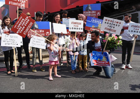 London, Britain. 3rd June, 2018. People hold placards during a commemoration to mark the one year anniversary of the deadly London Bridge terrorist attack in London, Britain, on June 3, 2018. Britain's capital fell silent Sunday as London remembered the eight people killed exactly a year ago in a terror attack on London Bridge and the nearby Borough Market. A one-minute silence was held on the bridge as well as across London following a service to honor the victims at Southwark Cathedral. Credit: Stephen Chung/Xinhua/Alamy Live News Stock Photo