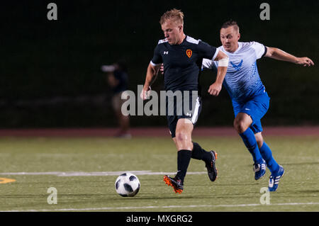 June 3, 2018 - Fort Bragg, North Carolina, US - June 3, 2018 - Fort Bragg, N.C., USA - All-Army Soccer 1st Lt. Alexander Clark (10) and All-Air Force Soccer Capt. John Melcher (8) in action during a first round match between the U.S. Army and U.S. Air Force at the 2018 Armed Forces MenÃ•s Soccer Championship, at Hedrick Stadium, on Fort Bragg. Air Force, the defending Armed Forces champions, defeated Army 2-1 in overtime. The Armed Forces MenÃ•s Soccer Championship is conducted every two years. (Credit Image: © Timothy L. Hale via ZUMA Wire) Stock Photo