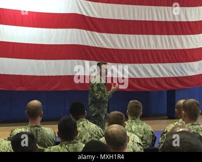 161101-N-5068Z-002 BAHRAIN (Nov. 01, 2016) Chief of Naval Personnel Vice Adm. Robert Burke speaks with Sailors during an all hands call discussing Sailor 2025 and rating modernization. Burke is  in Bahrain visiting Sailors assigned to the U.S. Navy's 5th Fleet of area of operation in the Middle East. (U.S. Navy photo by Lt. Cmdr.  Nathan Christensen/Released) Stock Photo