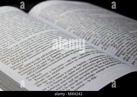 Open book showing a dialogue in spanish Stock Photo